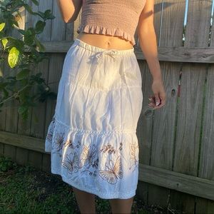Butterfly embellished white skirt